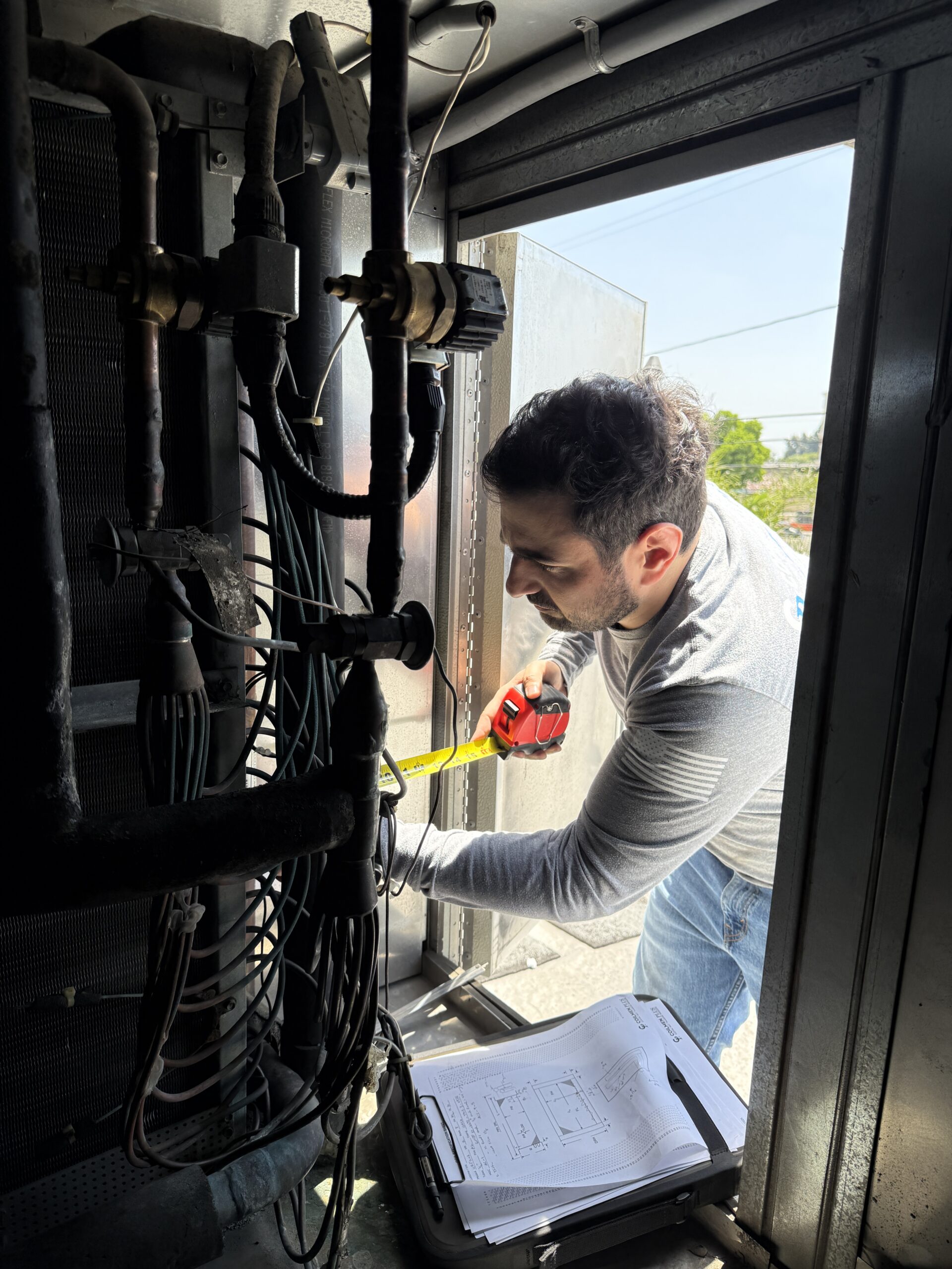 Field technician measuring coil on site