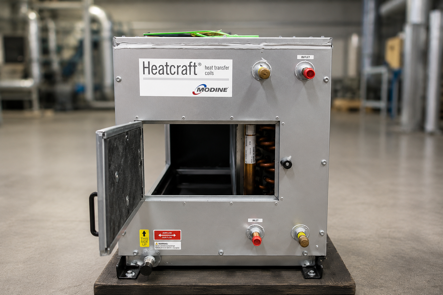 A M.A.R.C. removable coil cabinet with its access door open, showing the cased coil and inlet/outlet connections