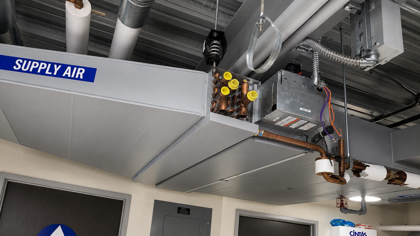 Installed hot water reheat coil on a VAV supply air terminal unit